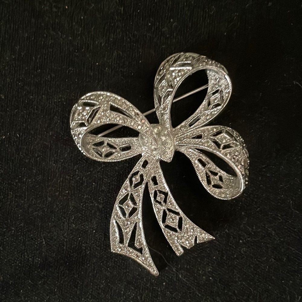 Vintage silver and rhinestone bow-shaped brooch